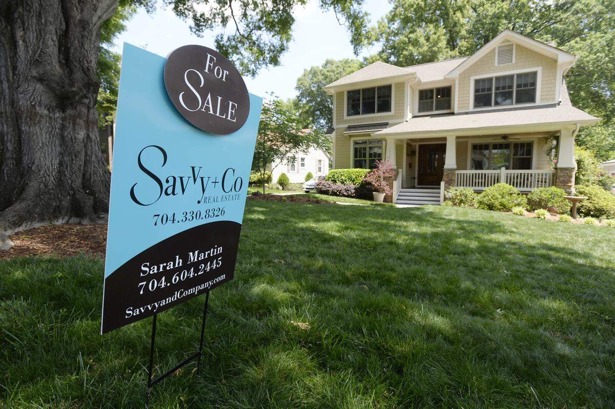 A home for sale along Springdale Avenue in Charlotte on Wednesday, May 9, 2018.
