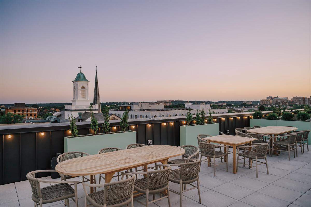 The open-air rooftop bar Good Fortune at Hotel Heron offers stunning views of the Potomac River, with comfortable seating and seasonal cocktails.