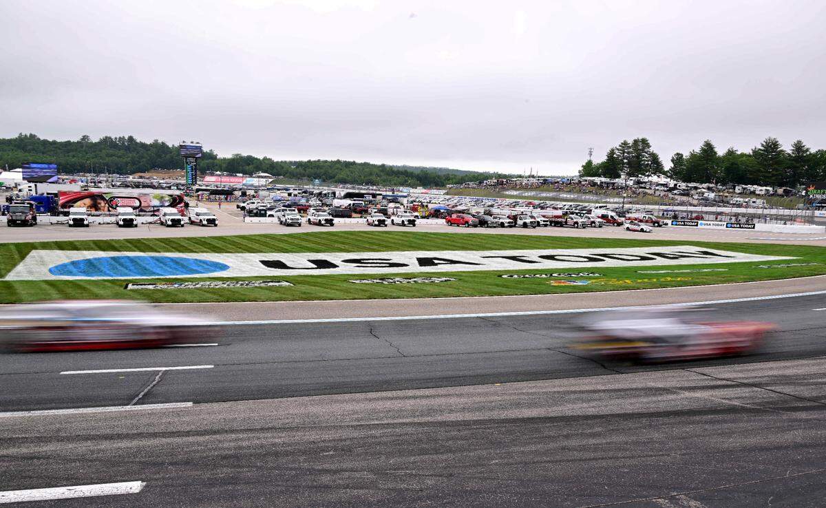 Jun 23, 2024; Loudon, New Hampshire, USA; Cars race through turns one and two during the USA Today 301 at New Hampshire Motor Speedway.