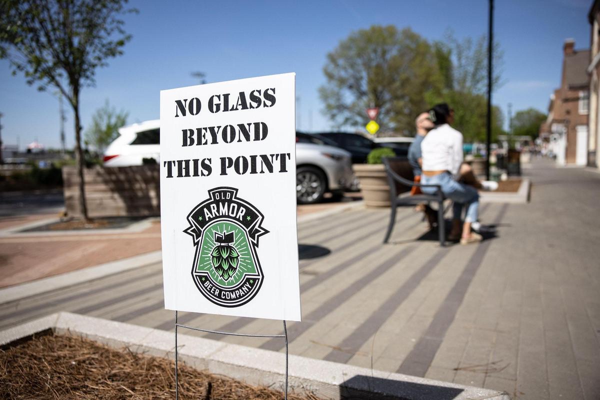 Social districts are set up with clear signs along streets and parks in defined areas, according to state law. That includes this ones outside of Old Armor Brewing in Kannapolis.