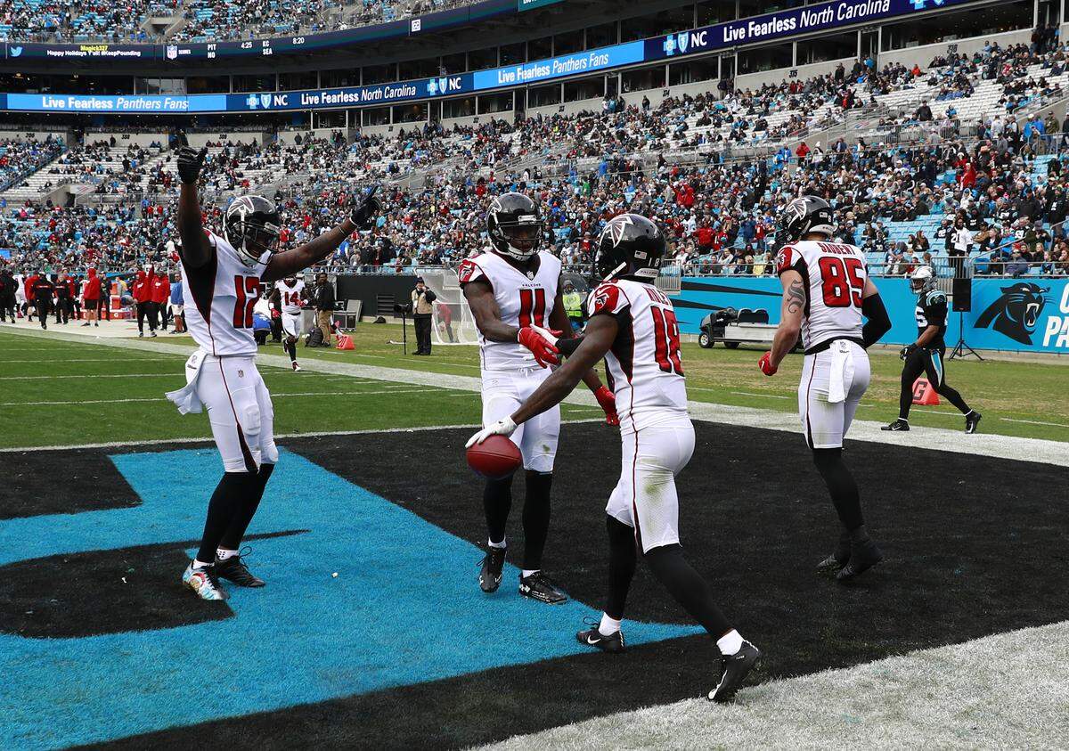 Atlanta Falcons’ Calvin Ridley (18) celebrates his touchdown catch and run against the Carolina Panthers with teammates during the second half of an NFL football game in Charlotte, N.C., Sunday, Dec. 23, 2018. (AP Photo/Jason E. Miczek)