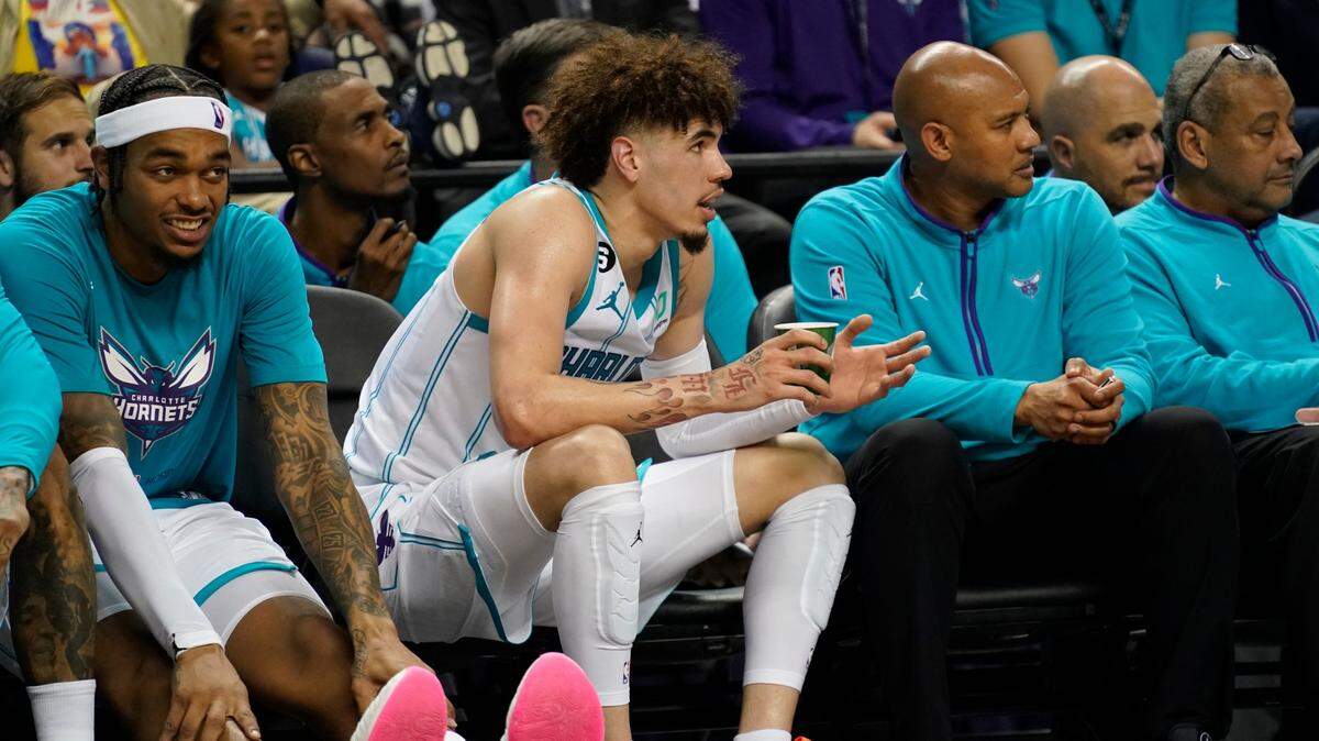 Charlotte Hornets’ LaMelo Ball, center, talks to an official from the bench after getting his sixth foul against the Boston Celtics during the second half of an NBA preseason basketball game in Greensboro, N.C., Friday, Oct. 7, 2022. (AP Photo/Chuck Burton)