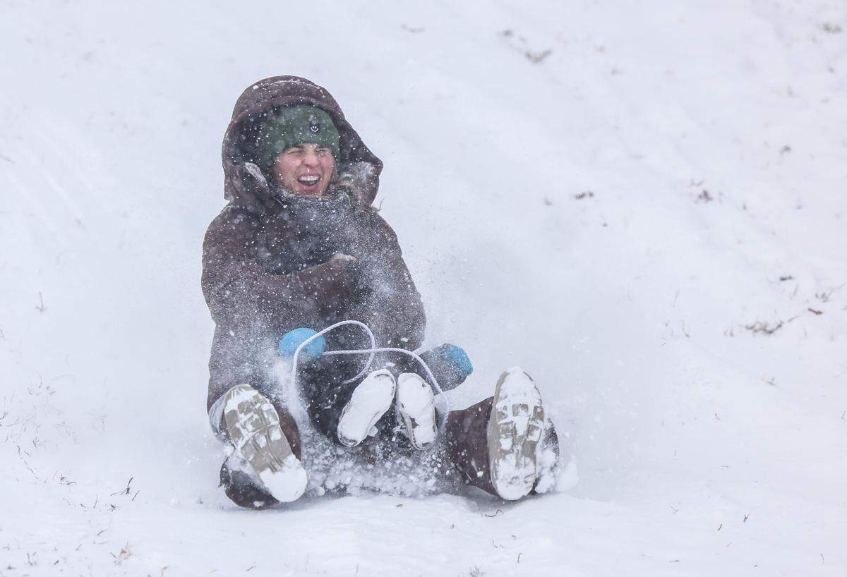 People sled in Cordelia Park in Charlotte, N.C., on Saturday, January 31, 2026.