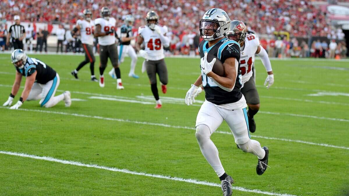 Carolina Panthers running back Chuba Hubbard catches a touchdown pass from quarterback Sam Darnold during first quarter action against the Tampa Bay Buccaneers at Raymond James Stadium in Tampa, Fl. on Sunday, January 9, 2022.