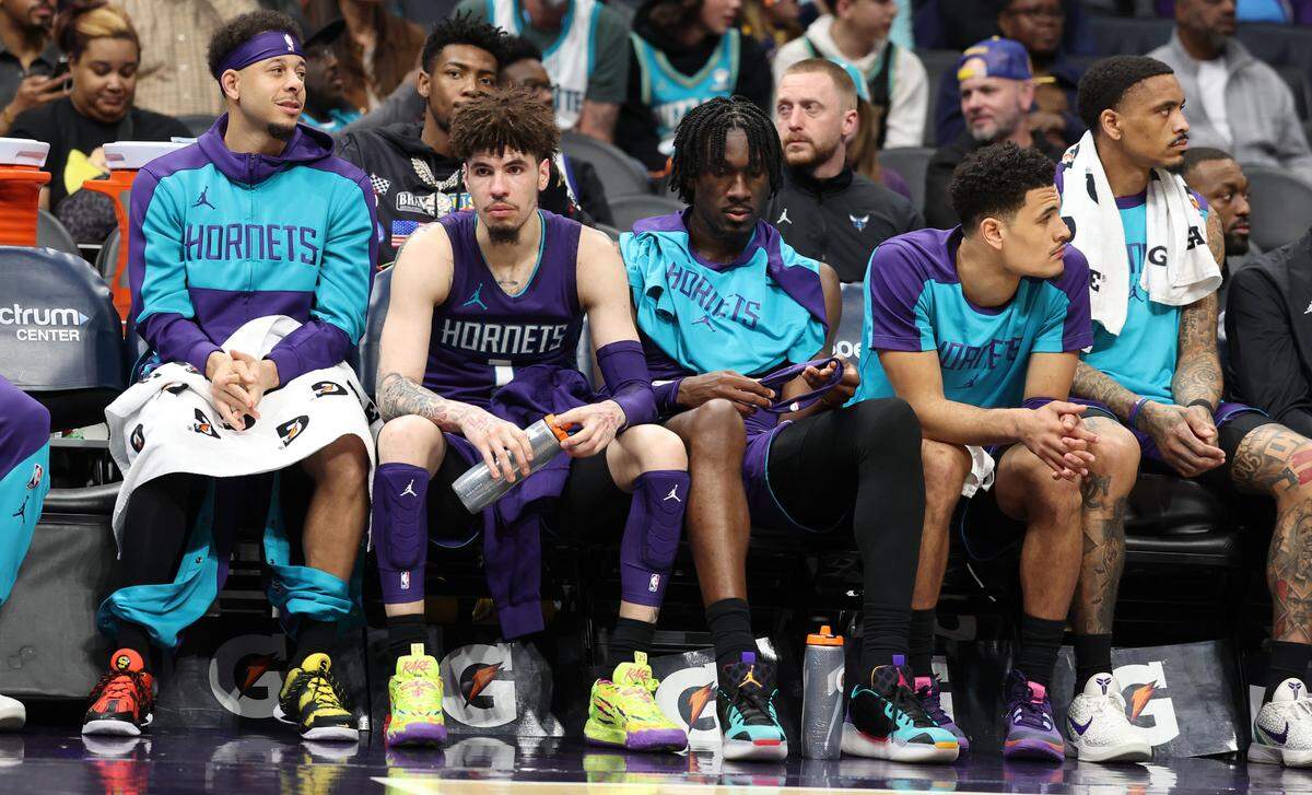 Members of the Charlotte Hornets sit on the bench in the closing moments of action against the Golden State Warriors at Spectrum Center in Charlotte, NC on Monday, March 3, 2025. The Warriors defeated the Charlotte Hornets 119-101.