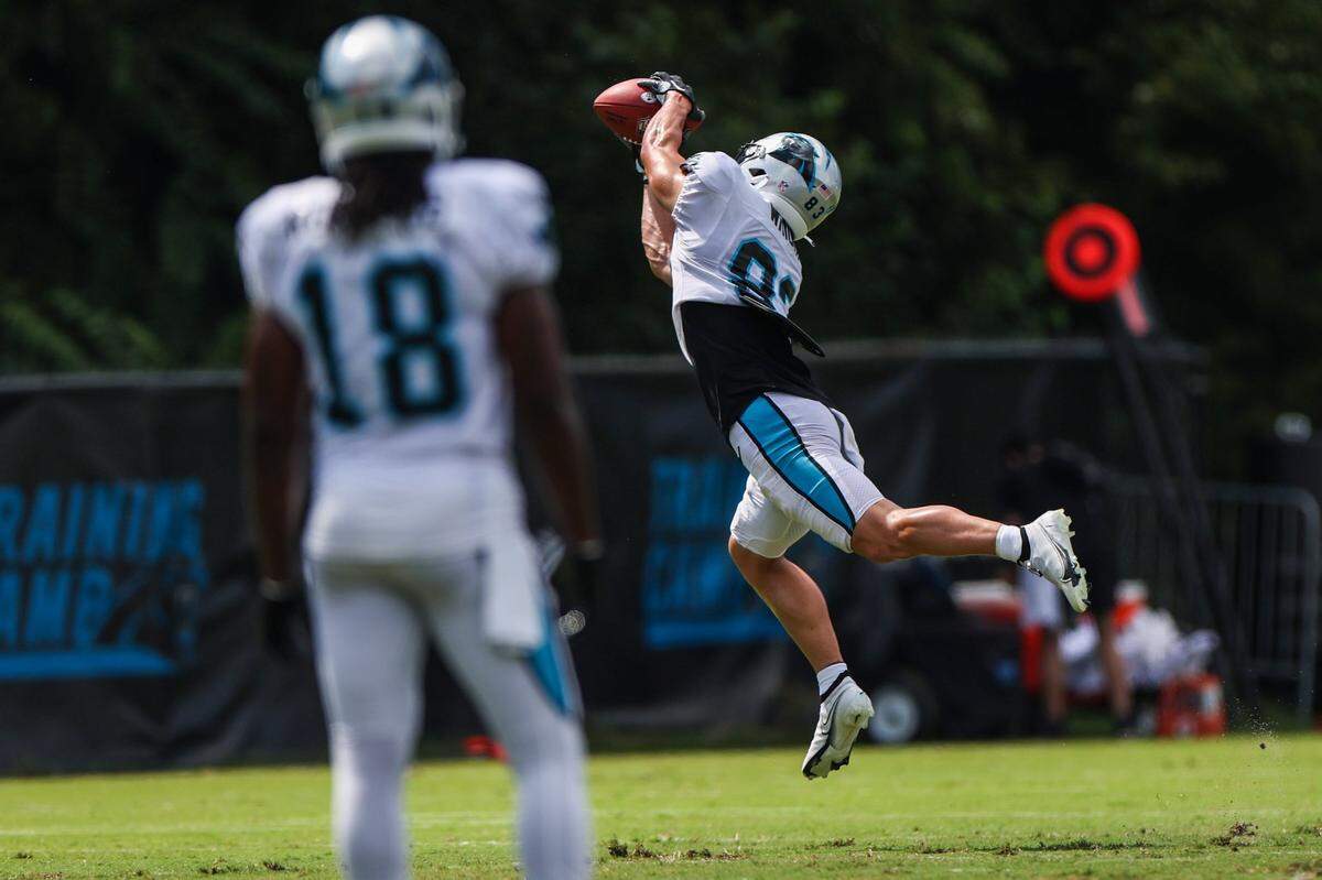 Panthers wide receiver Derek Wright, right, stretches to make a catch during training camp at Wofford College on Tuesday, August 9, 2022 in Spartanburg, SC.