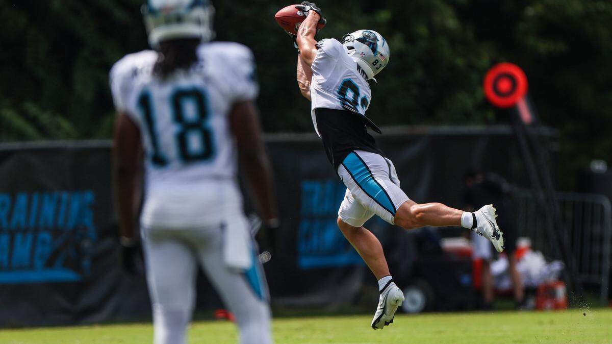Panthers wide receiver Derek Wright, right, stretches to make a catch during training camp at Wofford College on Tuesday, August 9, 2022 in Spartanburg, SC.