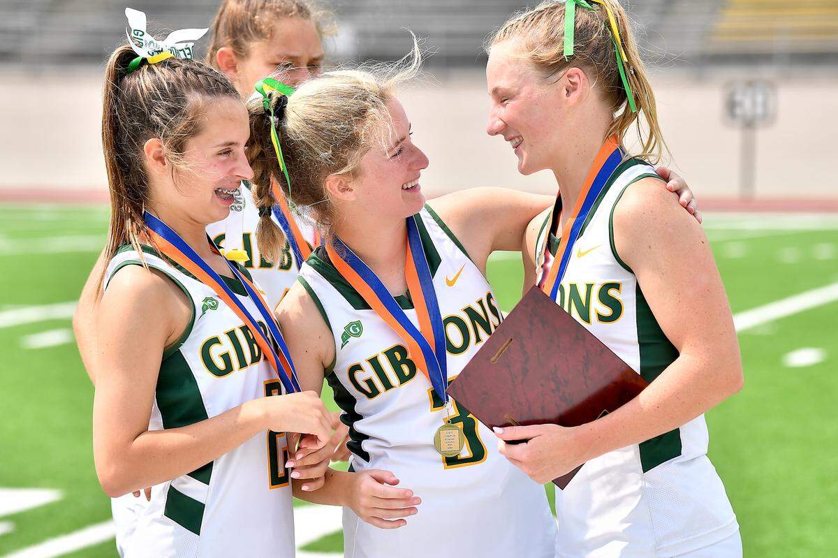 Cardinal Gibbons’ Adelaide Stephenson (2) and Chloe Tupis (3) congratulate Lexi Mullahy (1) on her Most Valuable Player award after their victory over Weddington in the NCHSAA 4A Girls Lacrosse Championship Game. The Weddington Warriors and the Cardinal Gibbons Crusaders met in the Girls NCHSAA 4A Lacrosse Championship Game in Durham, N.C. on May 31, 2025.