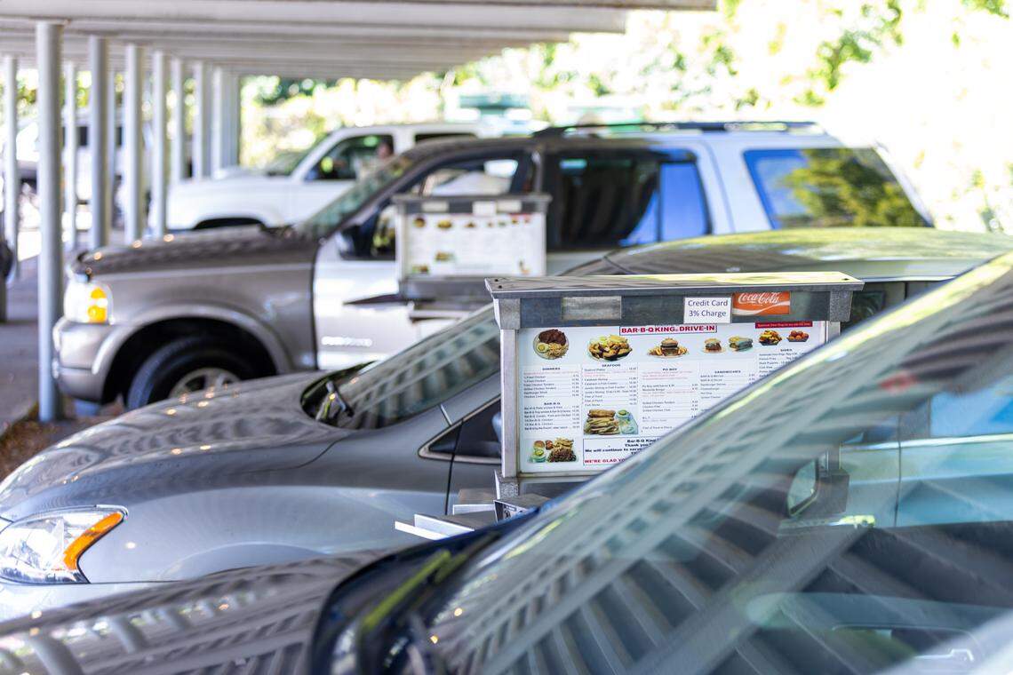 Cars pull up to the stalls to order at Bar-B-Q King on Wilkinson Boulevard in Charlotte.