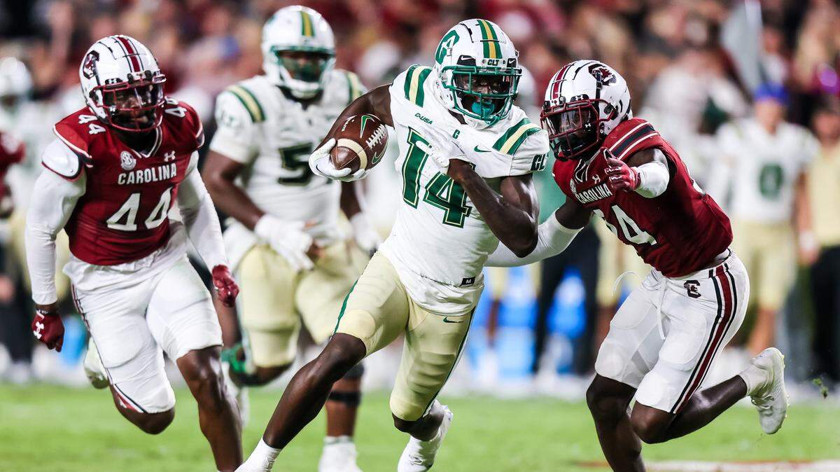 Charlotte 49ers wide receiver Grant DuBose (14) rushes past South Carolina Gamecocks defensive back Marcellas Dial (24) in the second quarter at Williams-Brice Stadium.