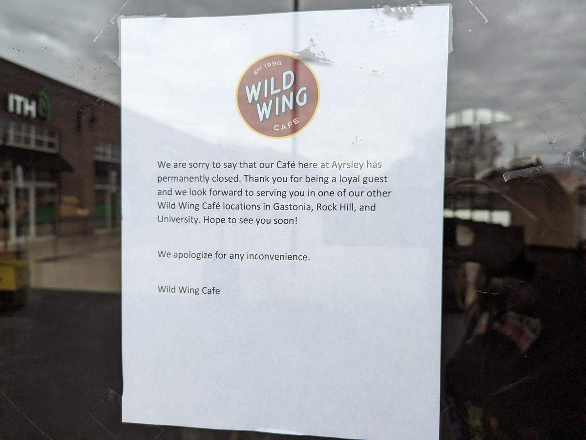 A sign posted Feb. 11 on the door at Wild Wing Cafe in Ayrsley says the restaurant is permanently closed.