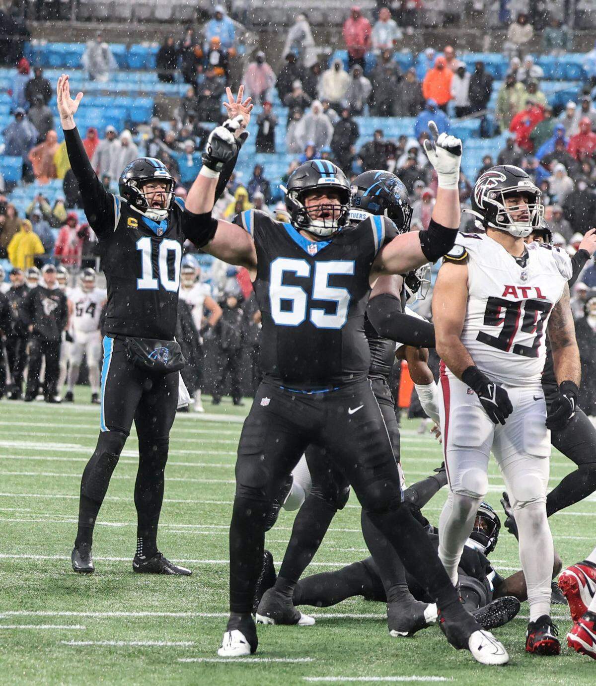 Carolina Panthers players celebrate place kicker Eddy Pineiro’s winning kick against the Atlanta Falcons at the Bank of America Stadium in Charlotte, N.C., on Sunday, December 17, 2023.
