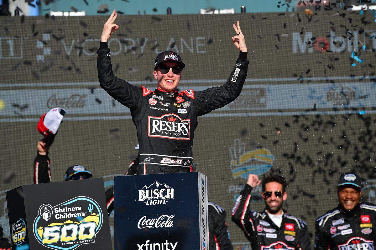 Mar 9, 2025; Avondale, Arizona, USA; NASCAR Cup Series driver Christopher Bell (20) celebrates his victory of the Shriners Children’s 500 at Phoenix Raceway.