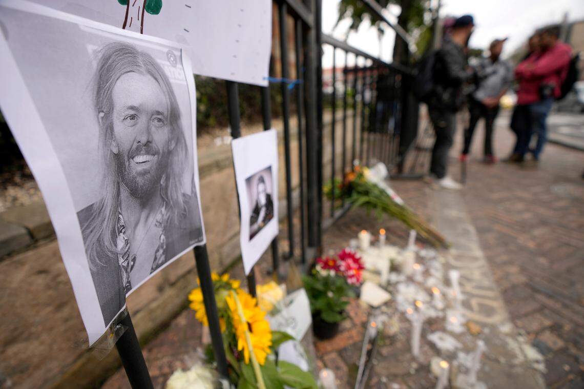 An image of Foo Fighters’ drummer Taylor Hawkins adorns a makeshift memorial outside the hotel where Hawkins was found dead, in northern Bogota, Colombia, Saturday, March 26, 2022. There were few immediate details on how Hawkins died, although the band said in a statement Friday that his death was a “tragic and untimely loss.” He was 50. (AP Photo/Fernando Vergara)