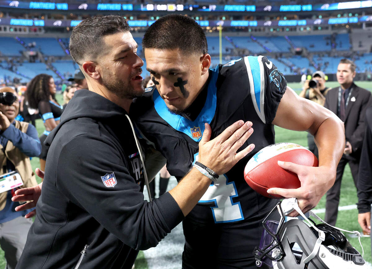 Carolina Panthers head coach Dave Canales, left, congratulates wide receiver Tetairoa McMillan, right, on his performance during action against the Detroit Lions at Bank of America Stadium in Charlotte, NC on Sunday, October 4, 2026. The Panthers defeated the Lions 32-26.