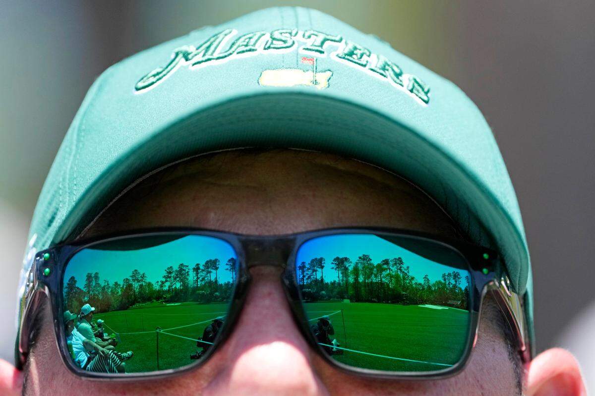A patron looks on from the Amen Corner during a practice round of the Masters Tournament at Augusta National Golf Club.