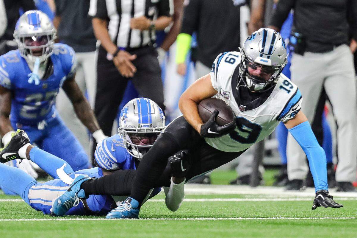 Lions safety Kerby Joseph tackles Panthers wide receiver Adam Thielen during the first half on Sunday, Oct. 8, 2023, at Ford Field.