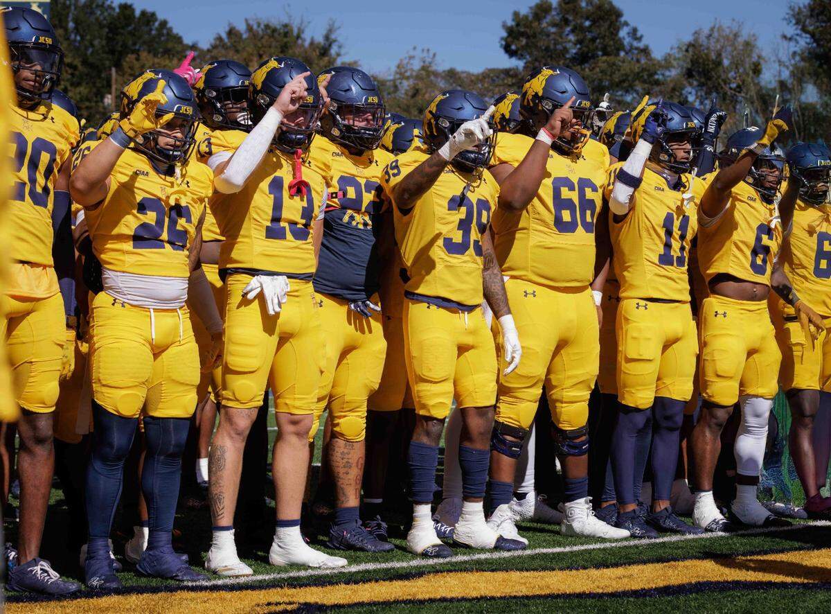 Johnson C. Smith players celebrate with their fans after winning their Homecoming game against Shaw on Oct. 19, 2024 in Charlotte.