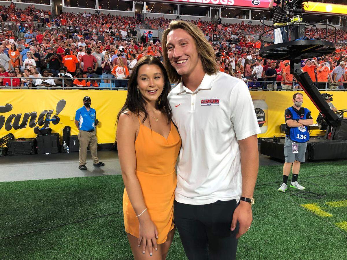 Former Clemson Tigers Trevor Lawrence and his wife enjoy the Tigers game against the Georgia Bulldogs at Bank of America Stadium on Saturday, September 4, 2021.