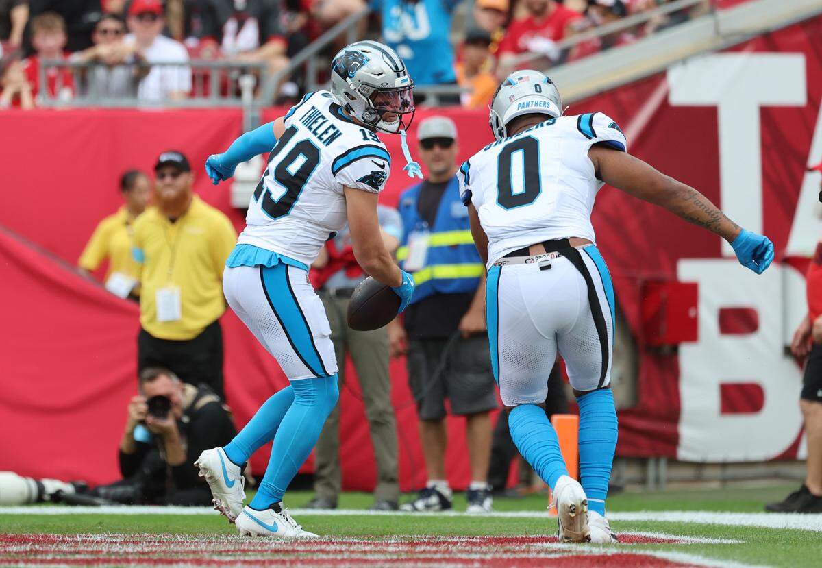 Carolina Panthers wide receiver Adam Thielen (19) is congratulated by tight end Ja’Tavion Sanders (0) after he scored a touchdown against the Tampa Bay Buccaneers during the first quarter at Raymond in Tampa, Fl. on Sunday Dec 29, 2024