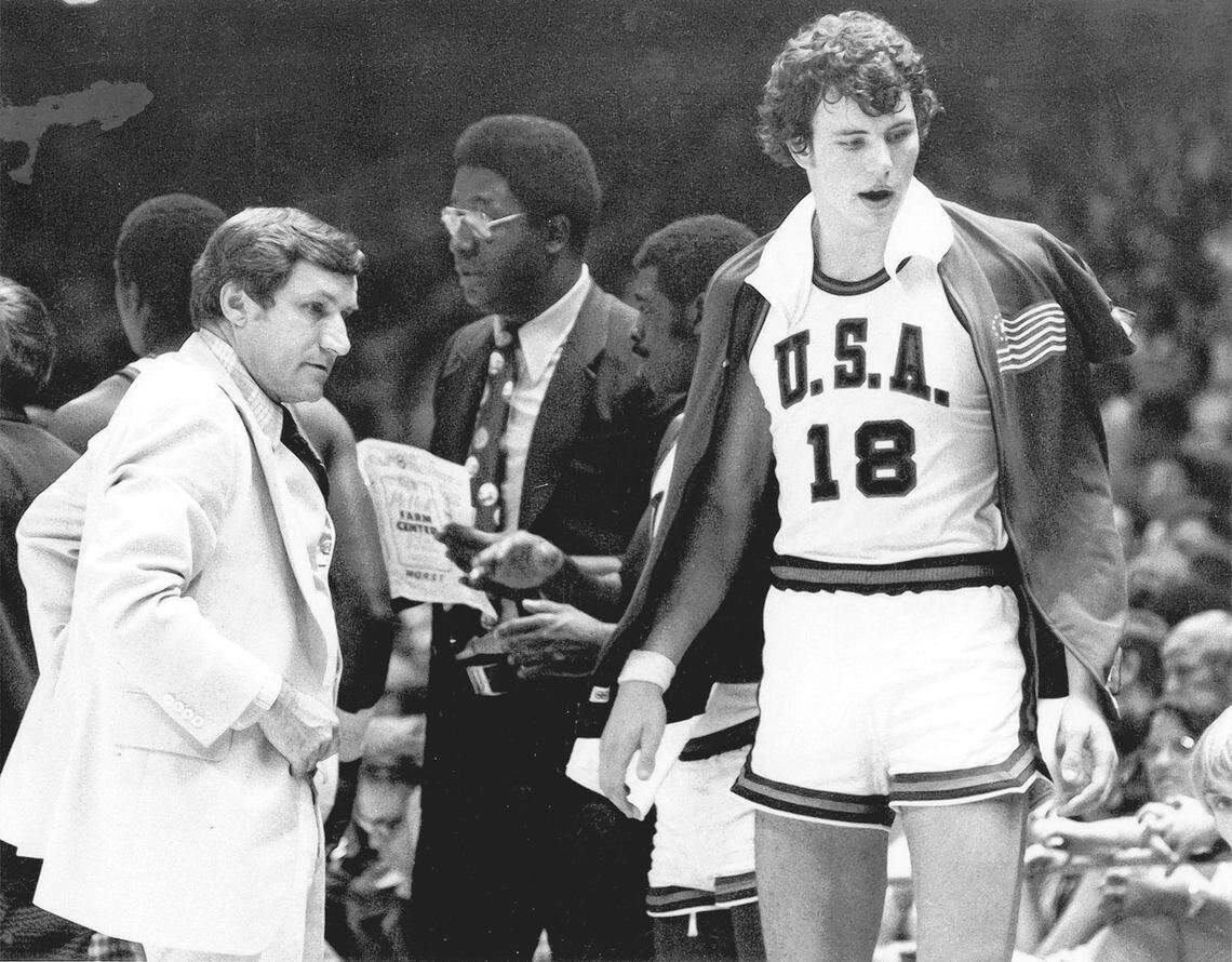 In 1976, Dean Smith (left) was the head coach of the U.S. Olympic team and asked John Thompson (center) to be one of the assistant coaches. On the right of this photo is Mitch Kupchak, who played for Smith at UNC and now is general manager of the Charlotte Hornets.