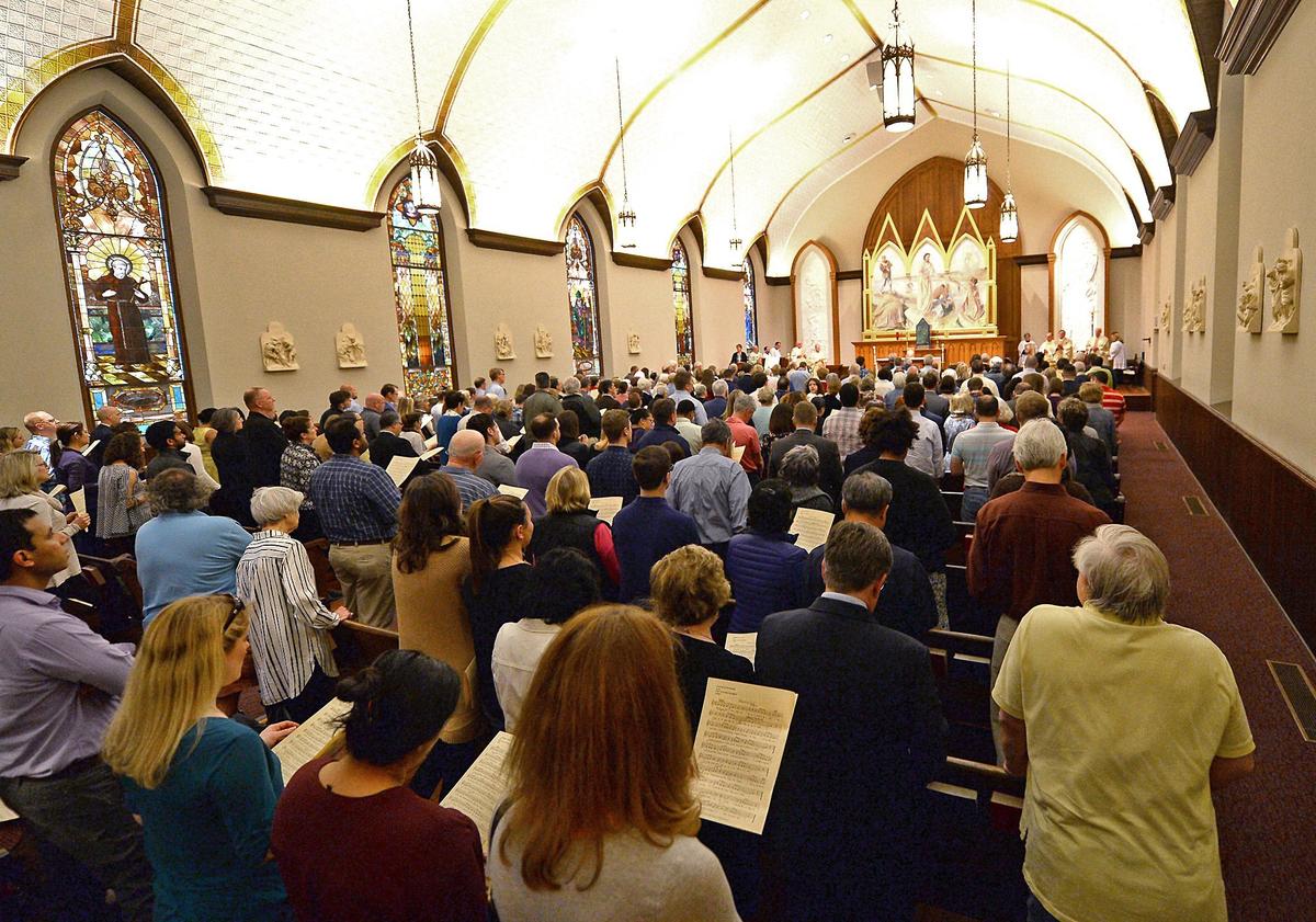 On Maundy Thursday, Christians remember Jesus' Last Supper with his apostles. At St. Peter Catholic Church in uptown Charlotte, NC, priests and lay servers washed parishioners' feet, as Jesus did for his disciples, and dispensed the Eucharist, which was introduced at that last meal.