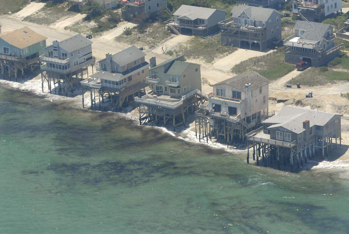 Rising sea levels, probably from global climate change, threaten homes along the N.C. Outer Banks, such as these in Nags Head.2010 OBSERVER FILE PHOTO - JOHN D. SIMMONS