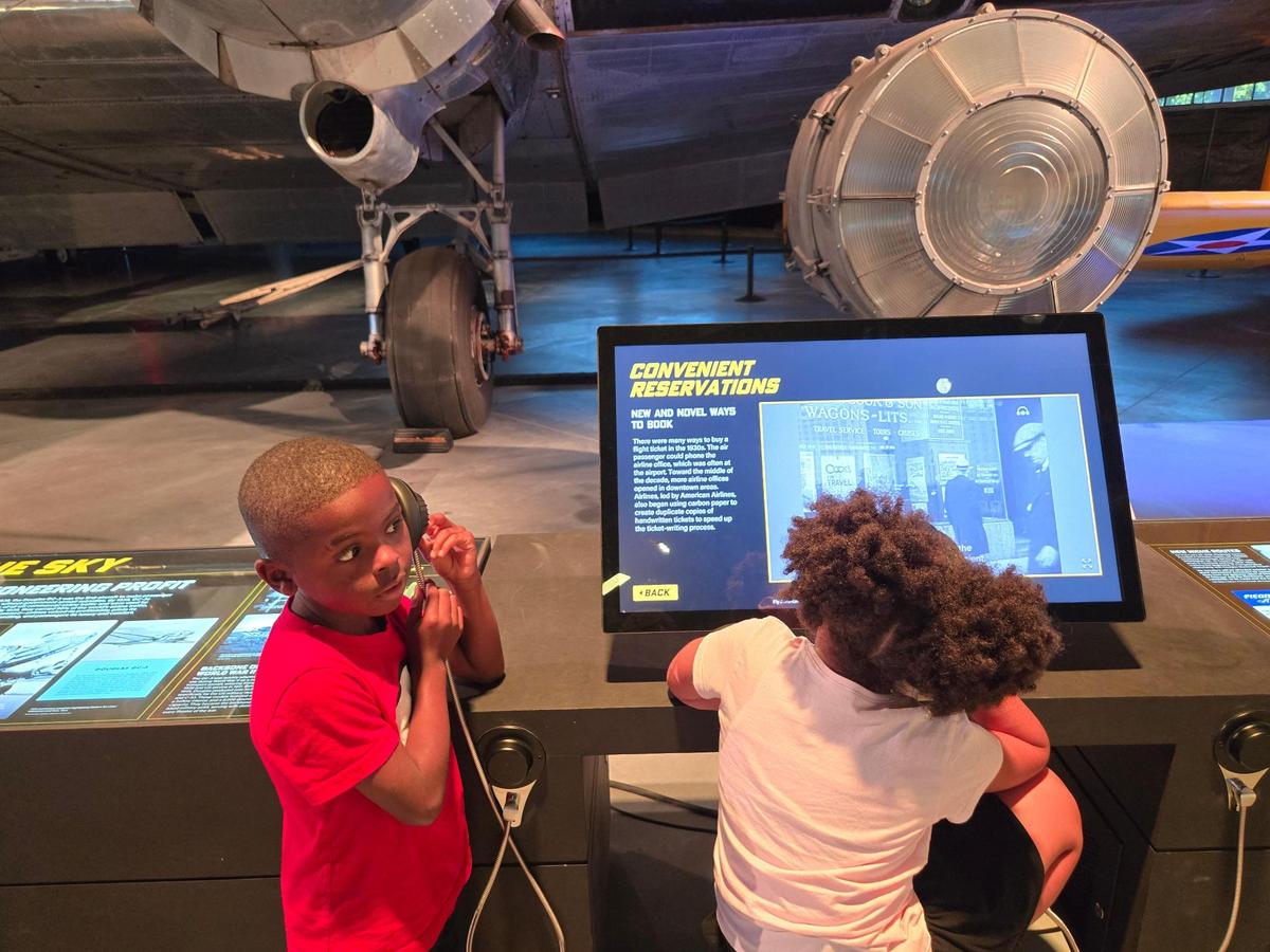 Children from the T. Jeffers Community Center’s summer camp enjoy learning about aviation history during a visit to the Sullenberger Aviation Museum.