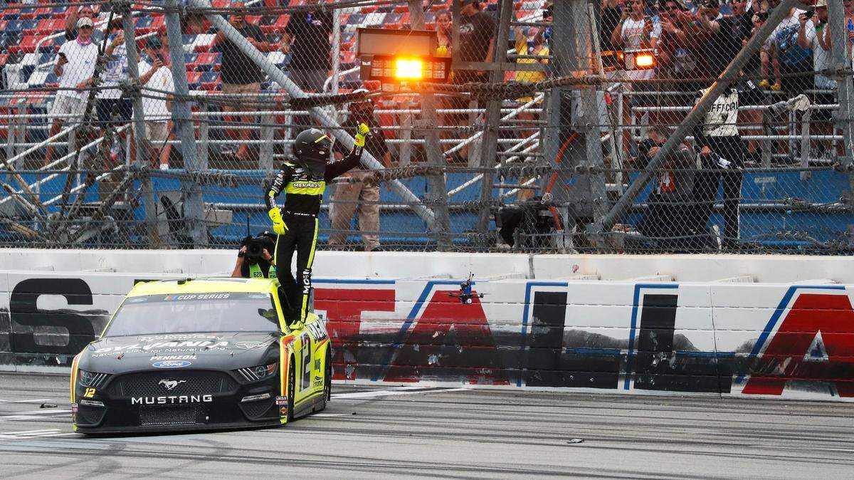 Ryan Blaney (12) celebrates winning a NASCAR Cup Series auto race at Talladega Superspeedway in Talladega Ala., Monday, June 22, 2020. (AP Photo/John Bazemore)