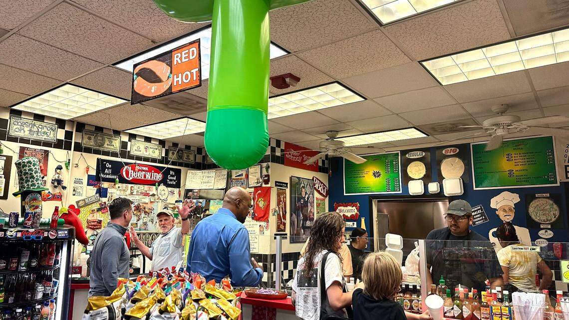 Johnny Burrito owner Johnny Bitter works the cash register at his beloved burrito joint of over 25 years.