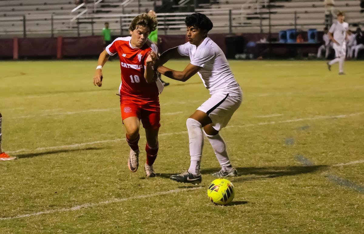 Keane LoCascio glides past his completion during the game at Charlotte Catholic High School in Pineville, NC on October 14th, 2024