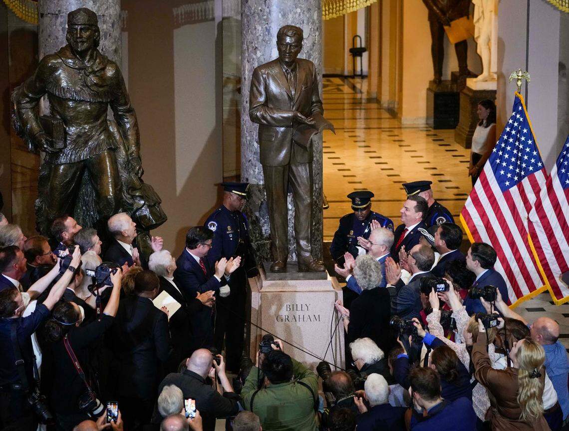 A crowd applauds during the May 16, 2024 unveiling of a statue of the late Rev. Billy Graham that now stands inside the U.S. Capitol in Washington, D.C.
