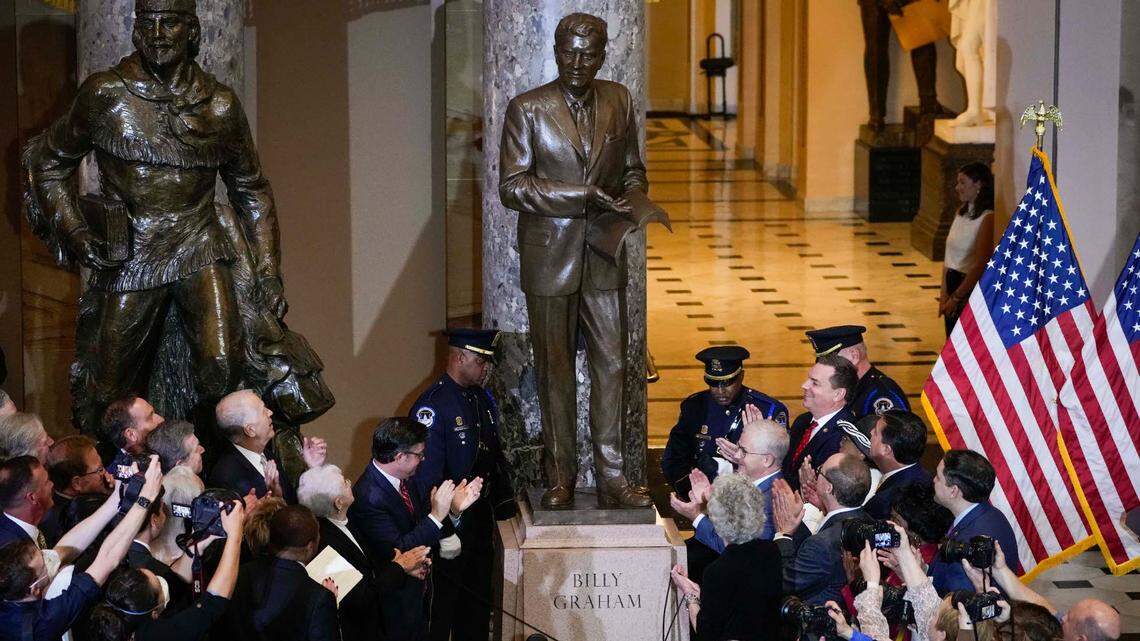 A crowd applauds during the May 16, 2024 unveiling of a statue of the late Rev. Billy Graham that now stands inside the U.S. Capitol in Washington, D.C. 
