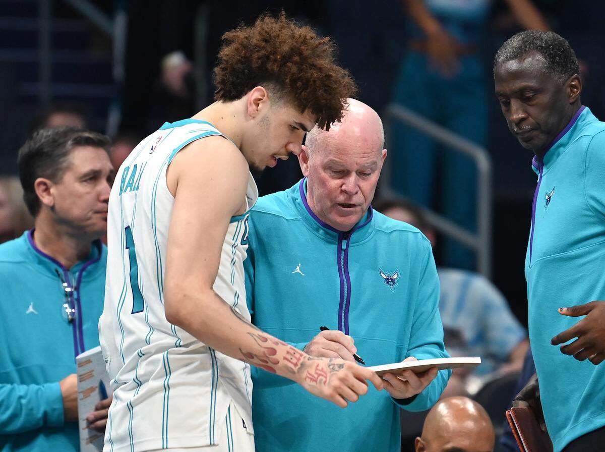 Charlotte Hornets guard LaMelo Ball, left, looks over plays with head coach Steve Clifford, right, prior to tipoff on Monday, October 10, 2022 at Spectrum Center in Charlotte, NC. The Hornets hosted the Washington Wizards in NBA preseason action.