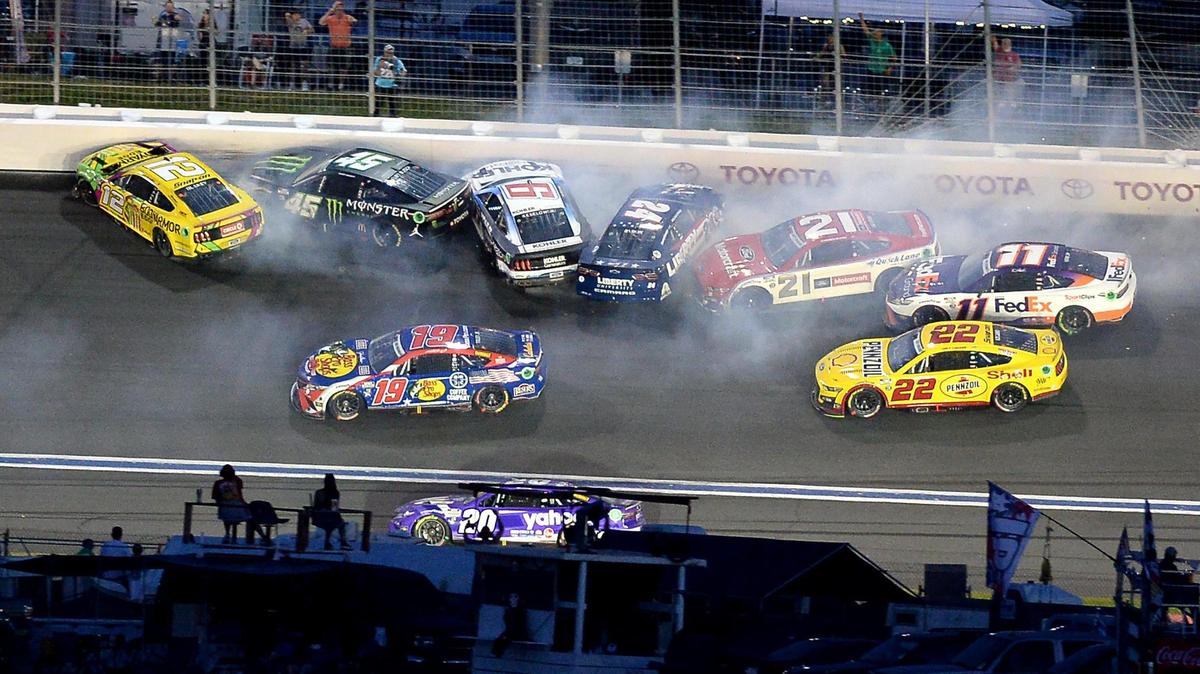 NASCAR drivers Ryan Blaney (12), Kurt Busch (45), Brad Keselowski (6), William Byron (24), Harrison Burton (21) and Denny Hamlin (11) wreck going into Turn 2 during the Coca-Cola 600 at Charlotte Motor Speedway on Sunday, May 29, 2022.