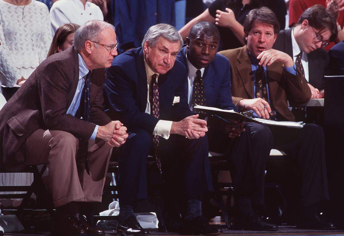 DEAN2.SP.FILE.TSS--CHAPEL HILL--The UNC coaching staff during a game in the 1996-97 season. From left: Asst. coach Bill Guthridge, head coach Dean Smith, Asst. coach Phil Ford, and Asst. coach Dave Hanners. staff/scott sharpe