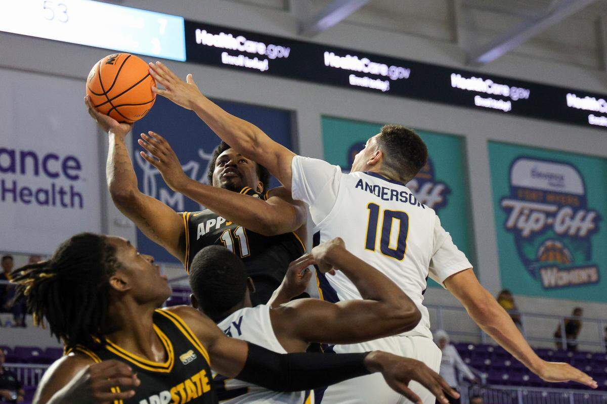 Nov 22, 2023; Fort Myers, FL, USA; Appalachian State Mountaineers forward Donovan Gregory (11) shot is blocked by Murray State Racers guard Quincy Anderson (10) in the second half during the Fort Myers Tip-Off at Suncoast Credit Union Arena. Mandatory Credit: Nathan Ray Seebeck-USA TODAY Sports