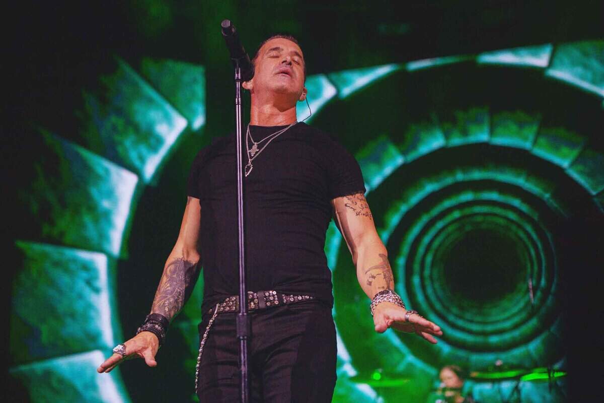 Lead singer Scott Stapp of Creed performs with the band at PNC Music Pavilion in Charlotte on Friday night.