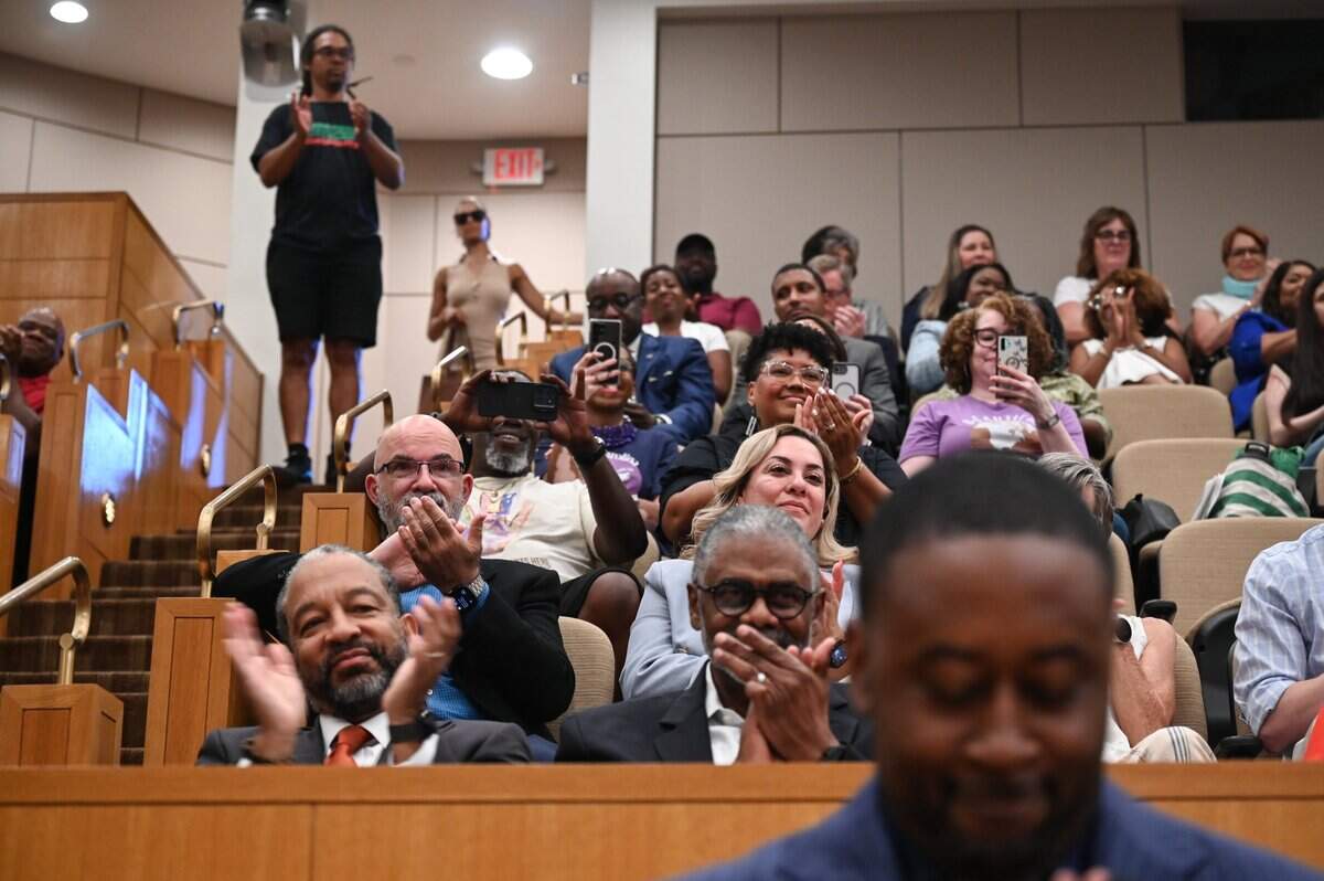 Members of the crowd applaud as a decree honoring Mayor Vi Lyles with The Order of the Long Leaf Pine during her final city council meeting at the Charlotte-Mecklenburg Government Center in Charlotte on Monday, June 22, 2026