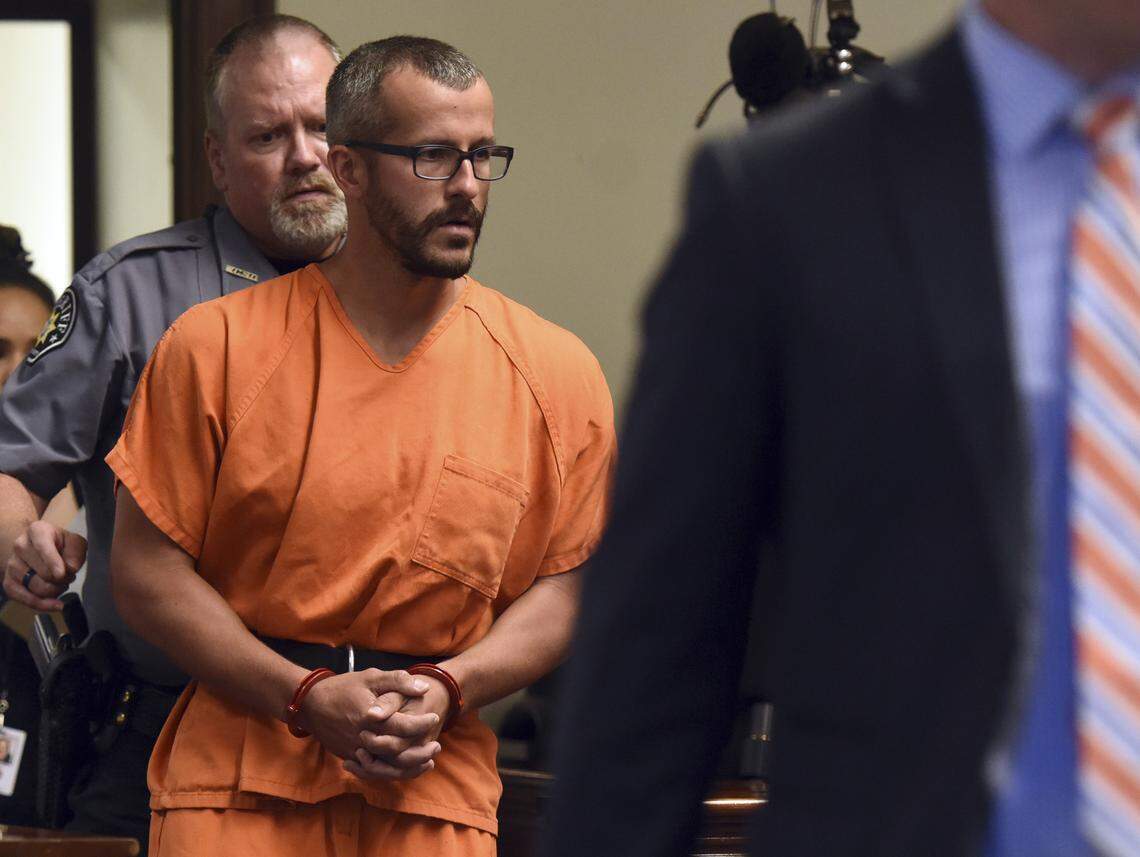 Christopher Watts is escorted into the courtroom before his bond hearing in August 2018 at the Weld County Courthouse in Greeley, Colo. The Colorado man, charged with killing his pregnant wife and two daughters, pleaded guilty under a plea deal that will allow him to avoid the death penalty, the district attorney said.