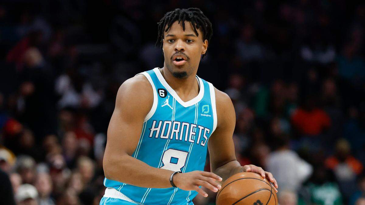 Charlotte Hornets guard Dennis Smith Jr. brings the ball up court against the Boston Celtics during the first half of an NBA basketball game in Charlotte, N.C., Monday, Jan. 16, 2023. (AP Photo/Nell Redmond)