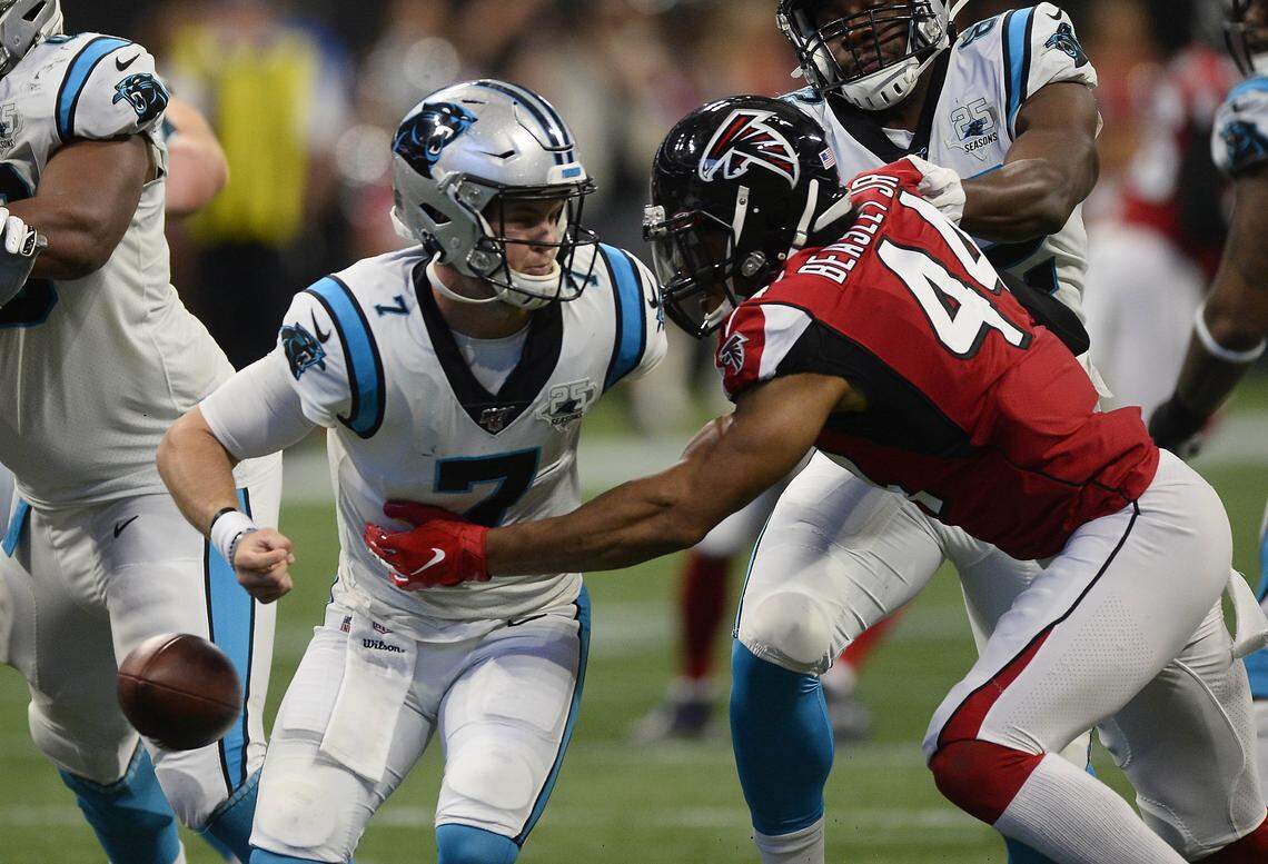 Carolina Panthers quarterback Kyle Allen (7) is stripped of the ball and sacked by Atlanta Falcons defensive end Vic Beasley (44) in the second half at Mercedes-Benz Stadium in Atlanta, Ga. on Sunday, December 8, 2019. Atlanta won, 40-20.