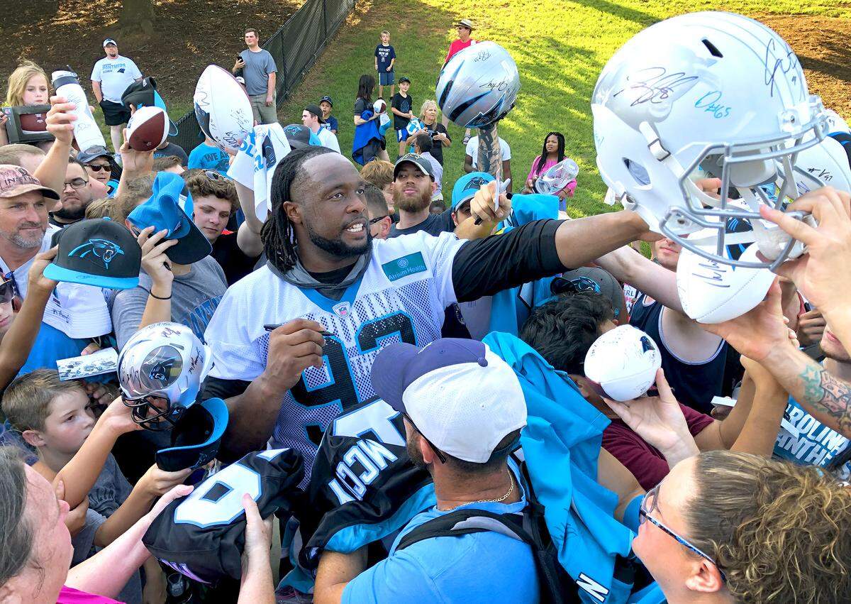 New Carolina Panthers defensive tackle Gerald McCoy has routinely climbed outside the white fence that separates players and fans to sign autographs during the early part of training camp, making himself a fan favorite.