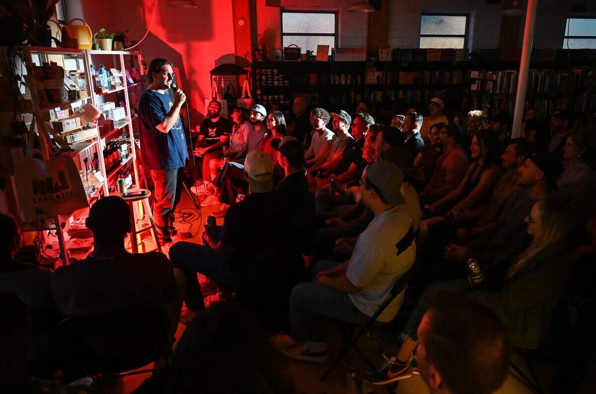 Mike Byrd performs his set to a sold-out crowd during the Don't Tell Comedy pop-up at That's Novel Books at Camp North End in Charlotte on Saturday, May 23, 2026.