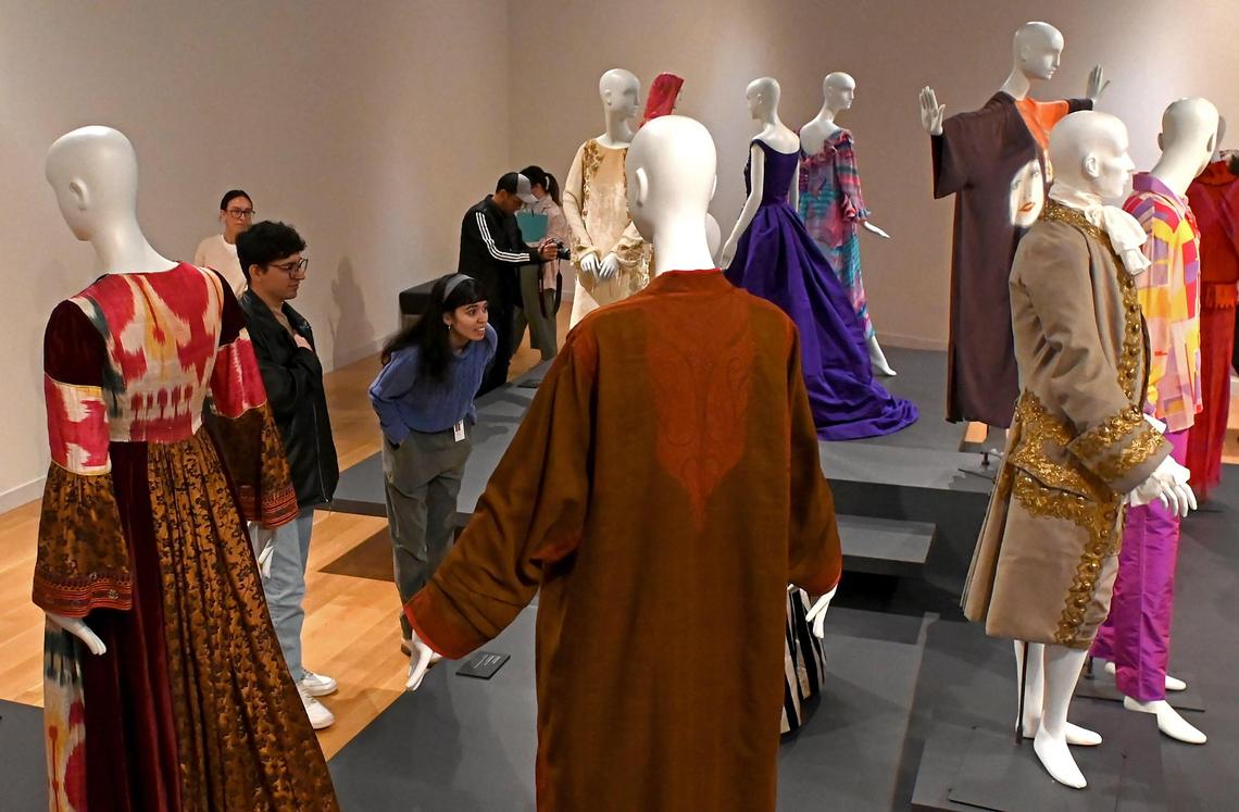 Attendees preview the Fashion Reimagined exhibit at the Mint Museum in uptown Charlotte. All of the pieces in the show came from the Mint's own collection.