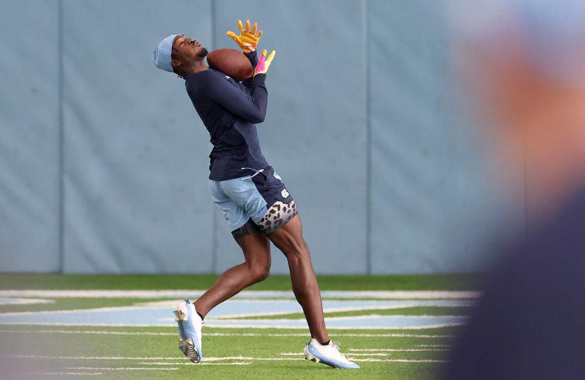 Wide receiver Tez Walker catches a deep pass from quarterback Drake Maye during the Carolina Football Pro Day at UNC Chapel Hill’s Koman Indoor Practice Facility on Thursday, March 28, 2024.