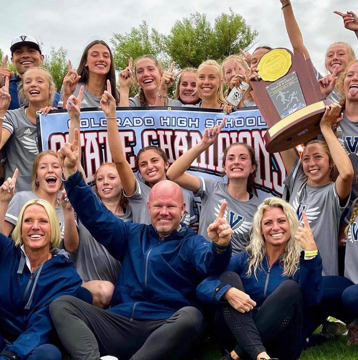 Brian Kula (center) and the Valor Christian High School female track team after winning the Colorado State Championships.