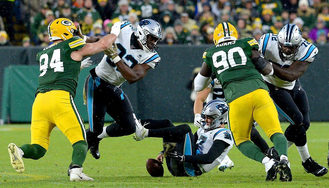 Carolina Panthers quarterback Kyle Allen fumbles the ball during the second quarter Sunday. The Packers recovered and later scored on the resulting drive.