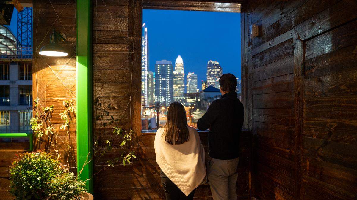 There is a view of uptown Charlotte from the upper level of Charlotte Beer Garden.