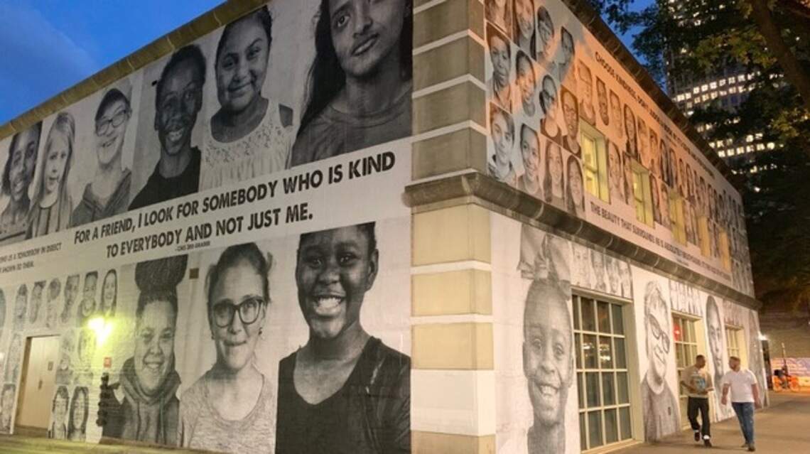 250 children’s faces are covering the main branch library. Here’s why.